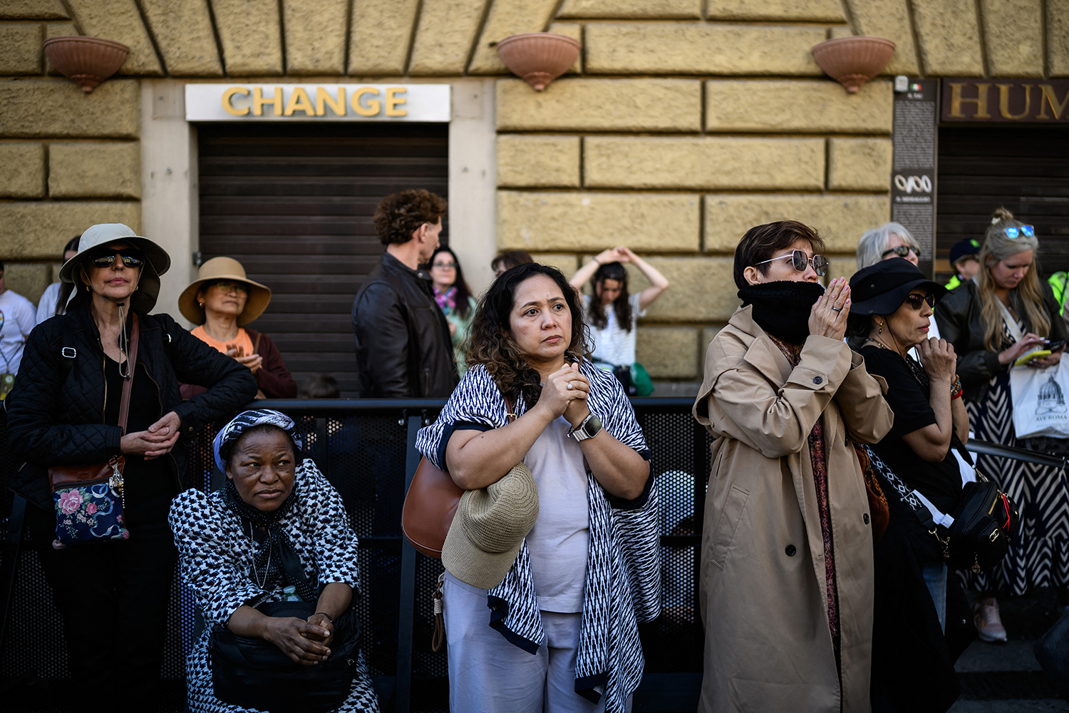 The faithful pray during Pope Francis’s funeral ceremony outside the Vatican. Photograph: Jeff Pachoud/AFP via Getty Images
