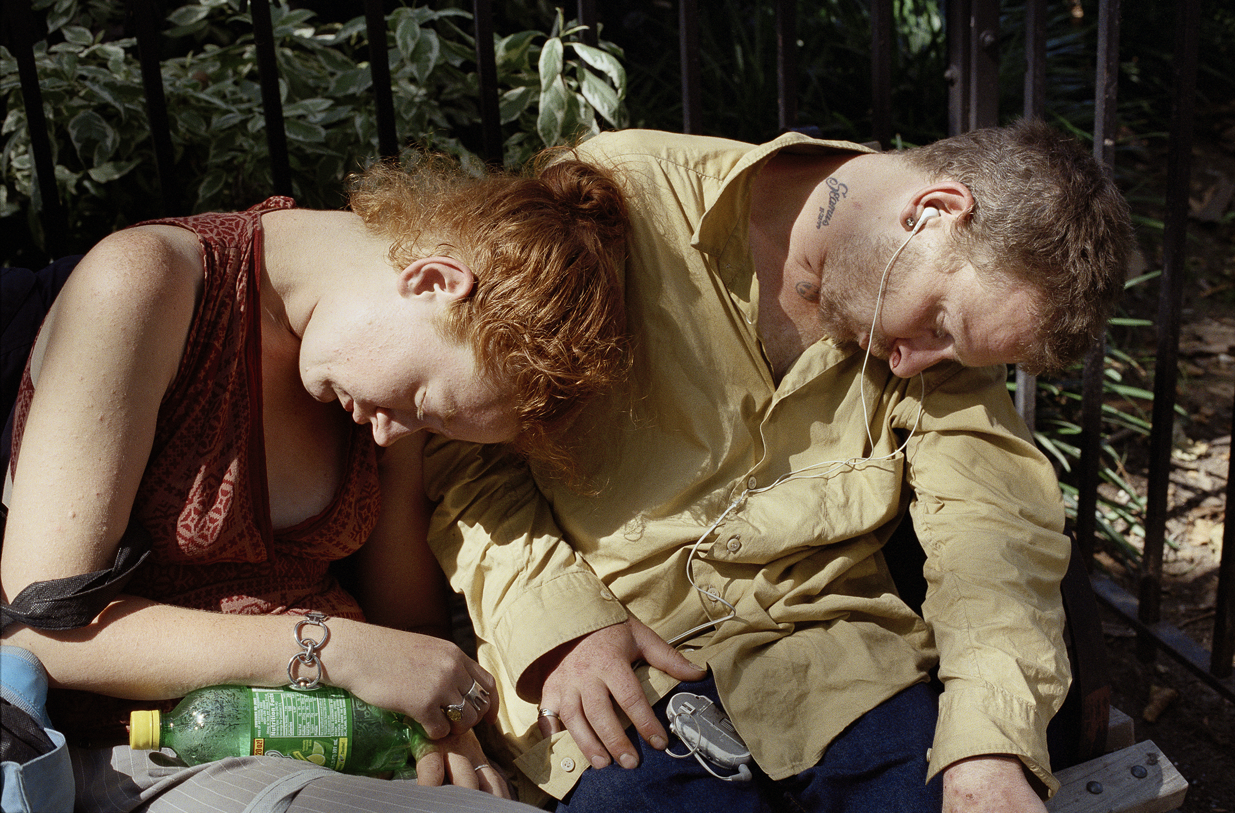 A couple asleep in Madison Square Park in New York City.
