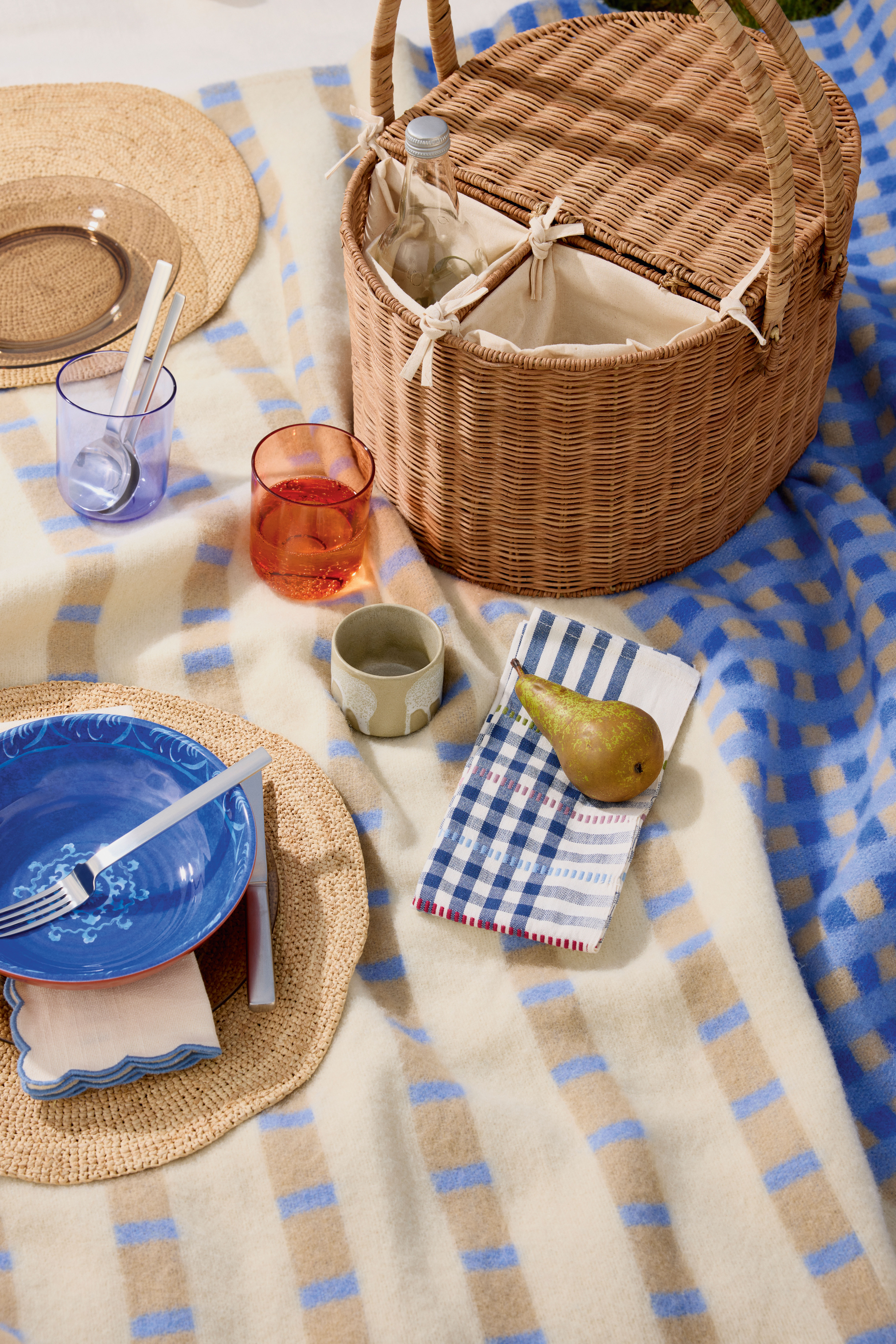 Plate £10 for 4, M&S;  Mats  £17.50, Toast; Tumblers  £8 for 4, M&S;  Cup  £19 for 2, Arket;  Hamper £40, M&S; Gingham napkins £80 for 4, Wicklewood;  Bowl £15 set of 4, M&S;  Cutlery £98 for 6-piece set, David Mellor Design;  Napkins £19.99 for 2, Zara; Blanket  £87, Arket