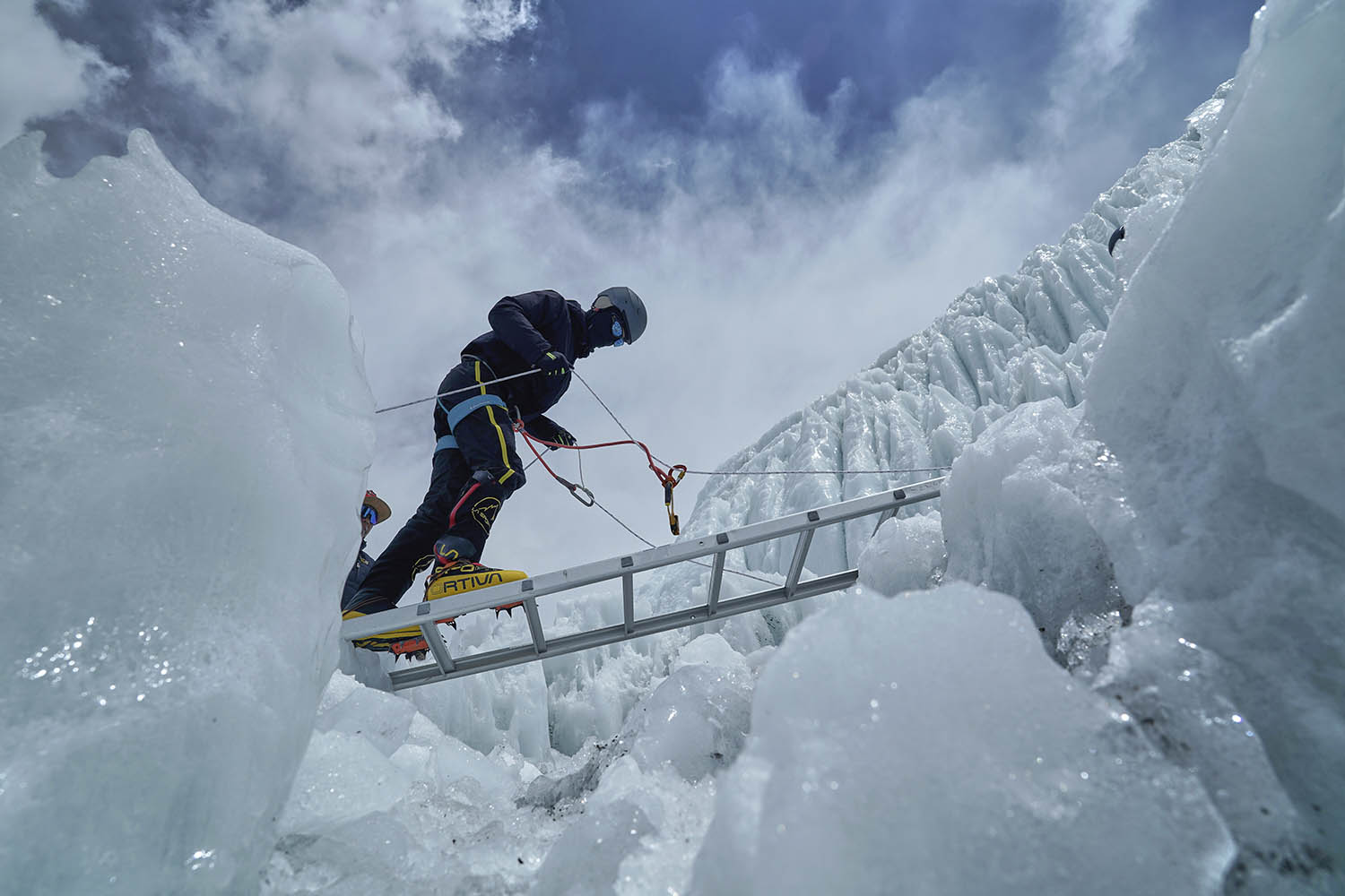A mountaineer practises ladder crossings in training at Khumbu Icefall, above base camp.