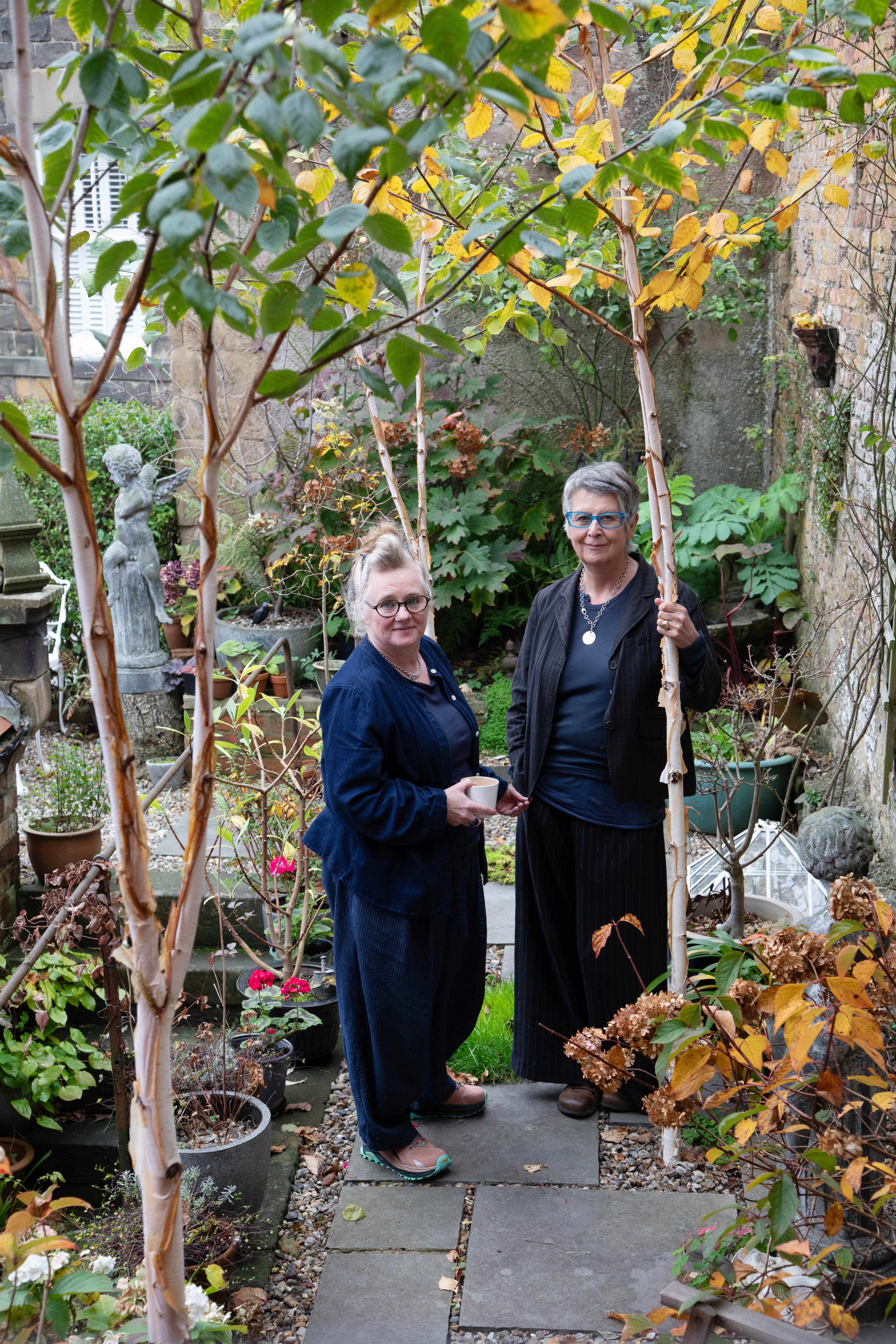 Maxine Hall (left) and Paula Moss in their walled garden