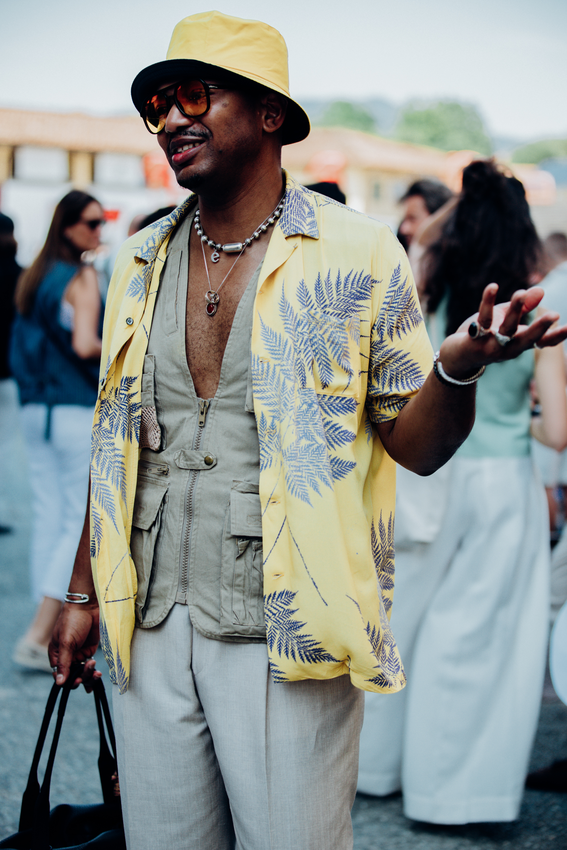 An on-trend butter yellow and utility look out and about on the streets of Florence