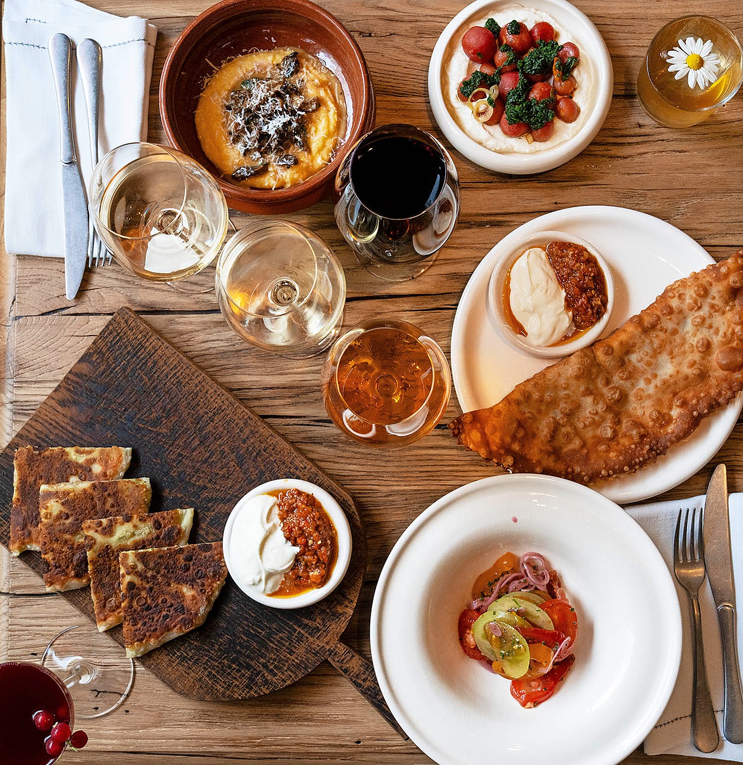 Olia ate minced lamb cheburek, £17. Rebecca ate plachinda with bryndza, £18. They shared pickled tomatoes, £9, banush with wild mushrooms, £23, tomato salad, £7. Olia drank glass of Arbina, £16, glass of Odesa Black, £12, gin and chamomile, £13. Rebecca drank two glasses of Telti-Kuruk, £13 each, vodka and cherry, £13