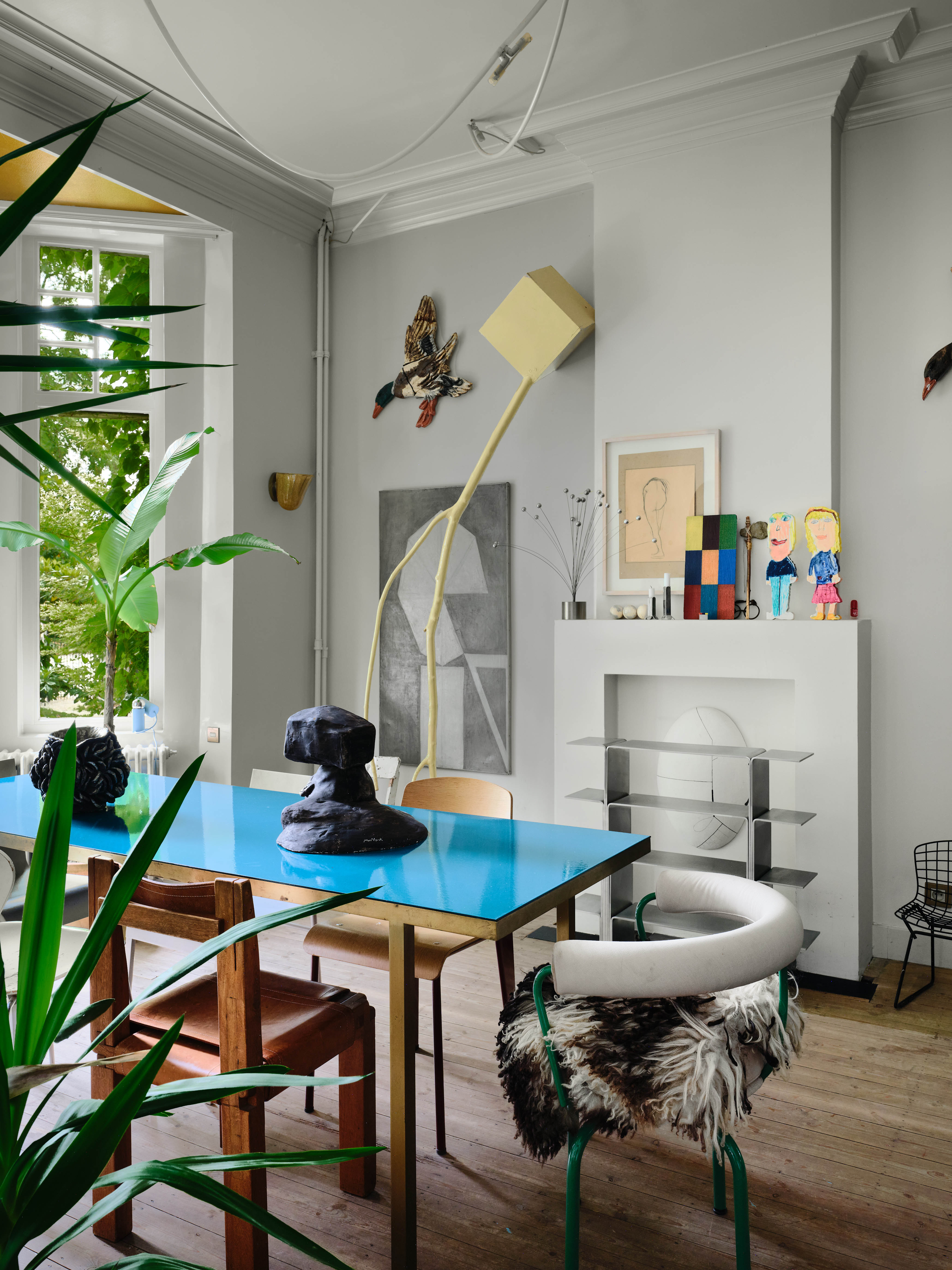 Built to last: artworks in the dining room, including portraits by one of Fien and Hannes’s daughters