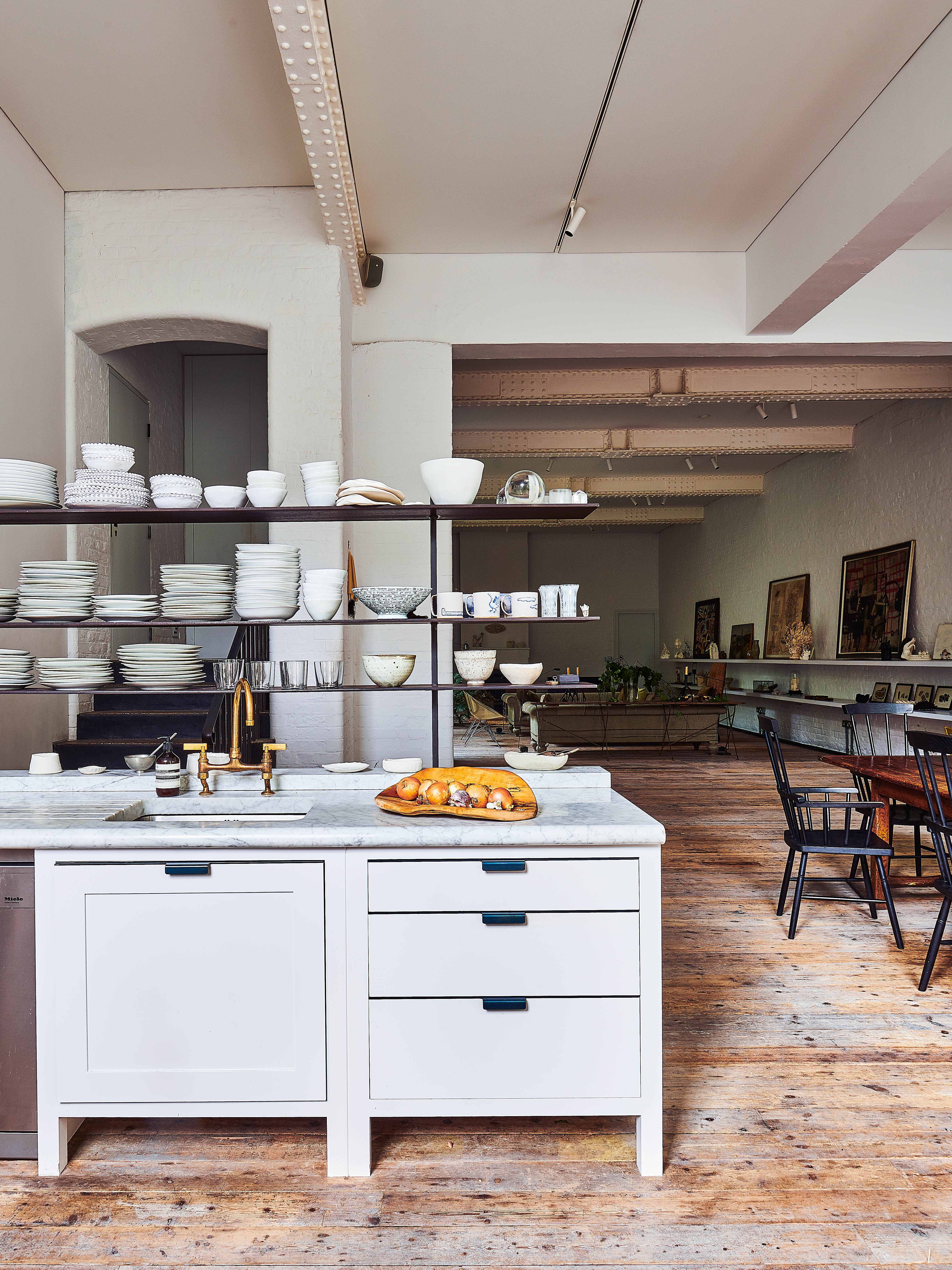 Cooking up a storm: marble tops and industrial beams in the kitchen area