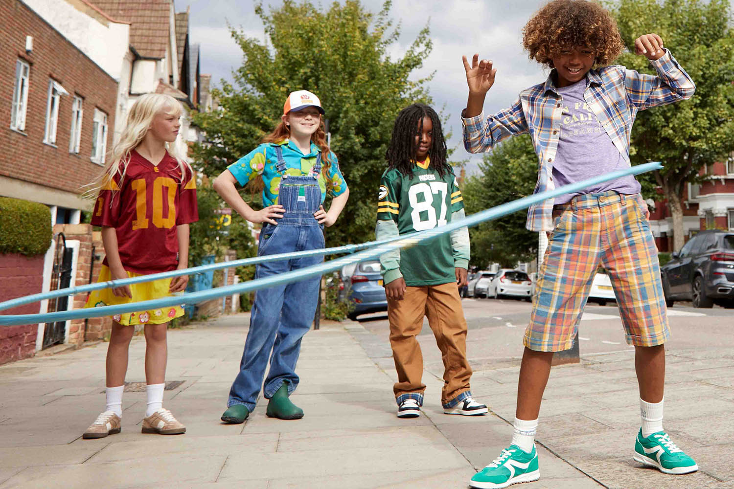 (Left to right) Marlowe Jersey, Mini Garms Gang. Skirt and trainers, both thelittleloop. Gwen Shirt and dungarees, And They Wear. Boots, Merry People. Amar Jersey, long-sleeve top, trousers and trainers, all Mini Garms Gang. Raphael Shirt, T-shirt, shorts and trainers, all Second Snuggle